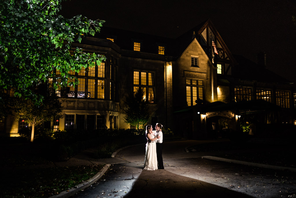 Romantic night photo of bride and groom outside of their Michigan Shores Club wedding reception