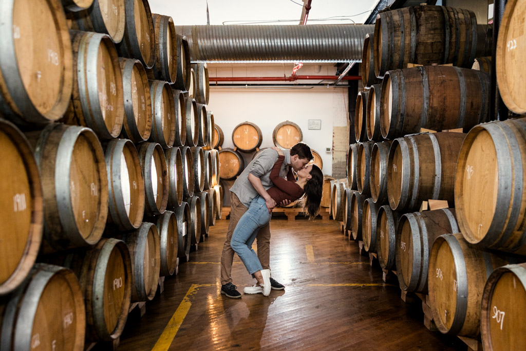 Romantic Chicago brewery engagement photo in Barrel Room at Dovetail Brewing