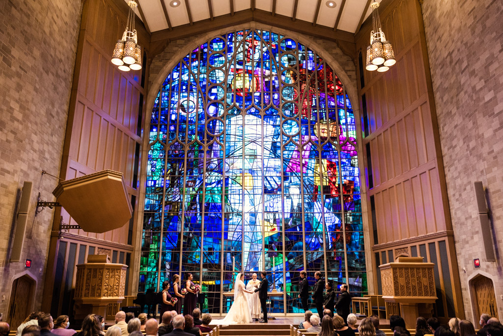 Alice Millar Chapel wedding ceremony with colorful stained glass window in Evanston, Illinois
