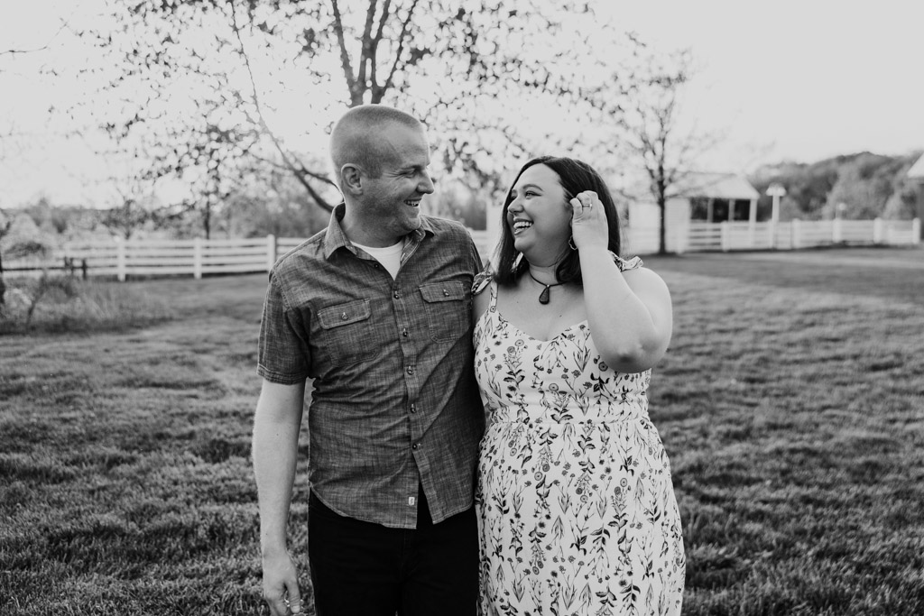 Black and white photo of smiling couple during forest preserve engagement