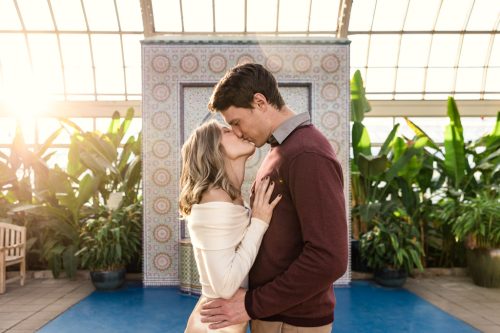 Romantic Garfield Park Conservatory engagement photo with mosaic fountain in Chicago