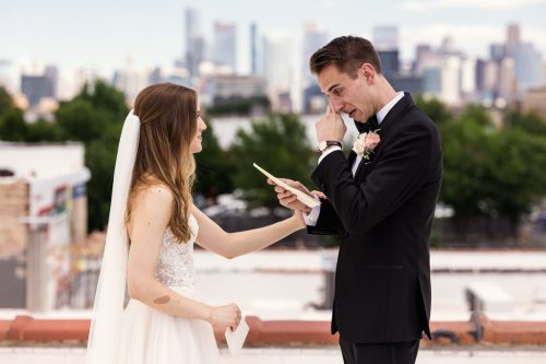 Emotional groom wipes tear during private vow exchange with bride at Walden rooftop in Chicago