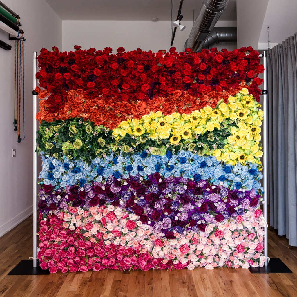 Custom rainbow flower wall backdrop option for Chicago photo booth by Emma Mullins Photography