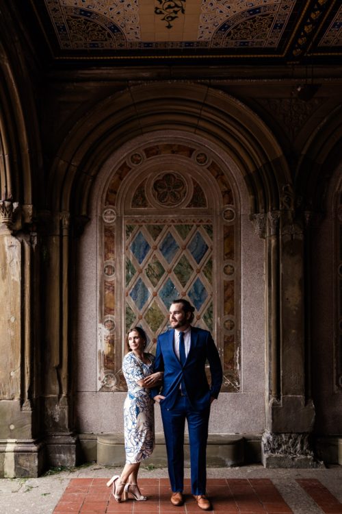 Creative portrait of couple standing in front of mosaic at Bethesda Terrace during Central Park engagement session