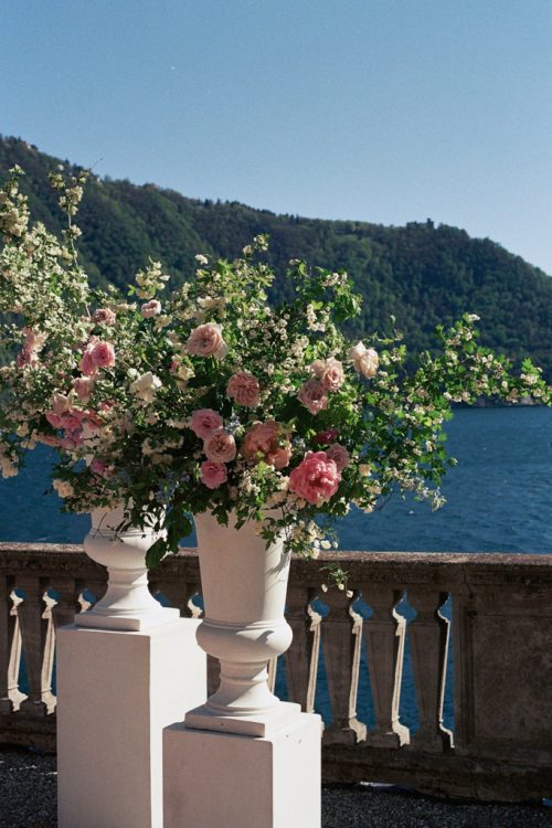 Blush and white florals at Italian Villa wedding ceremony space overlooking Lake Como