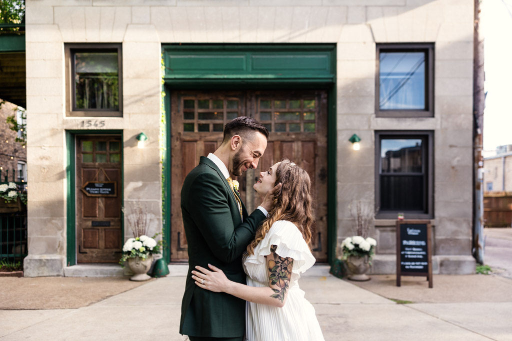 Romantic photo of just married couple outside Firehouse Chicago wedding venue in Edgewater neighborhood