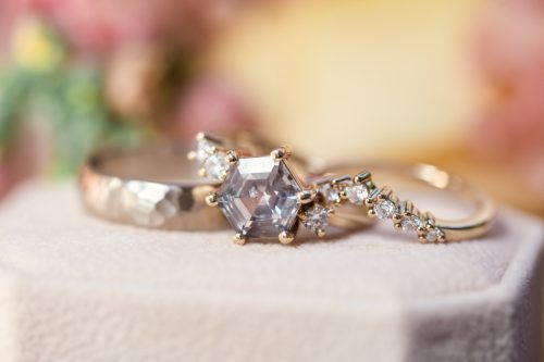 Detail photo of wedding rings on ring box