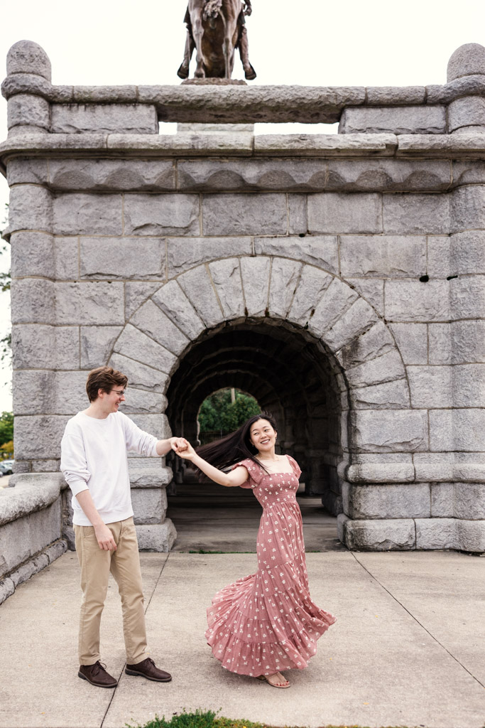 Couple dances near Ulysses S. Grant Monument during sunrise Lincoln Park engagement session