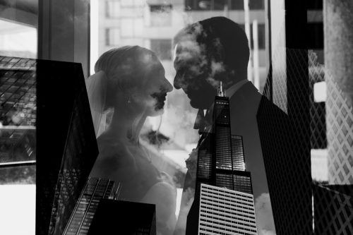 Creative double exposure of bride and groom, mixed with downtown Chicago skyscrapers and clouds