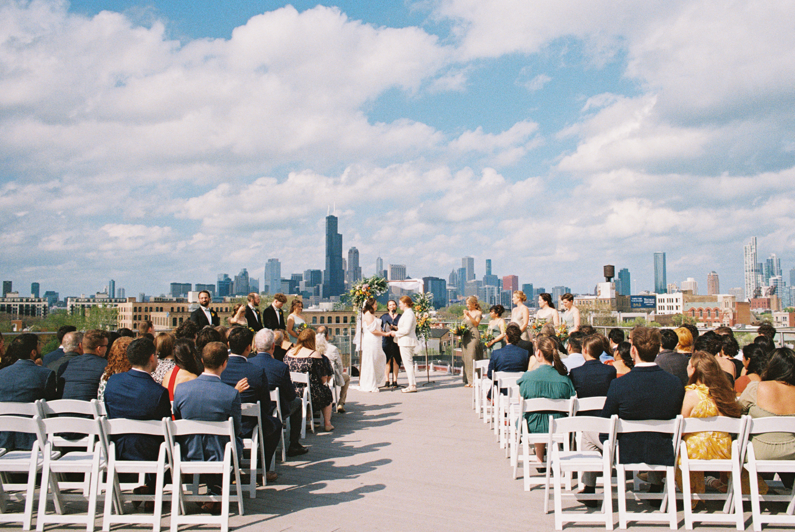 Rooftop wedding ceremony at Lacuna Lofts with Chicago skyline view captured on 35mm film