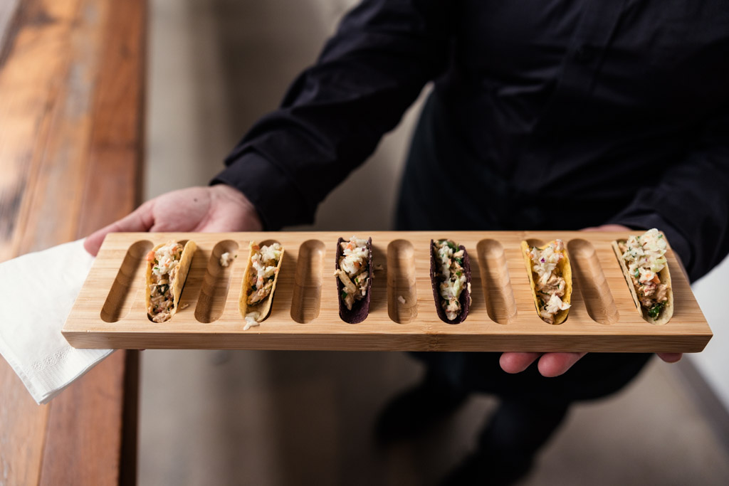 Tray of taco appetizers arranged in a row for Ovation Chicago wedding reception