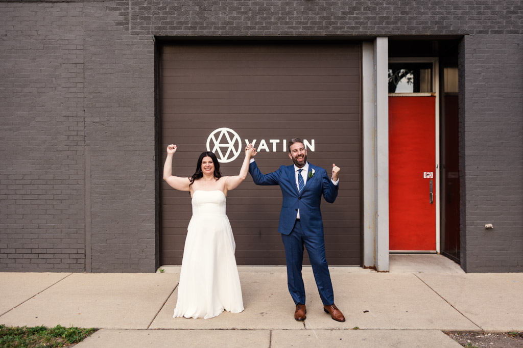 Bride and groom celebrate their wedding outside Ovation Chicago