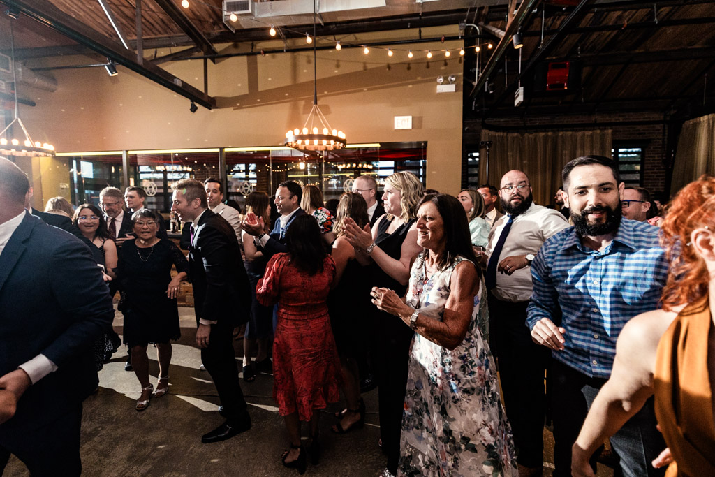 Happy guests on the dance floor during Ovation Chicago wedding reception