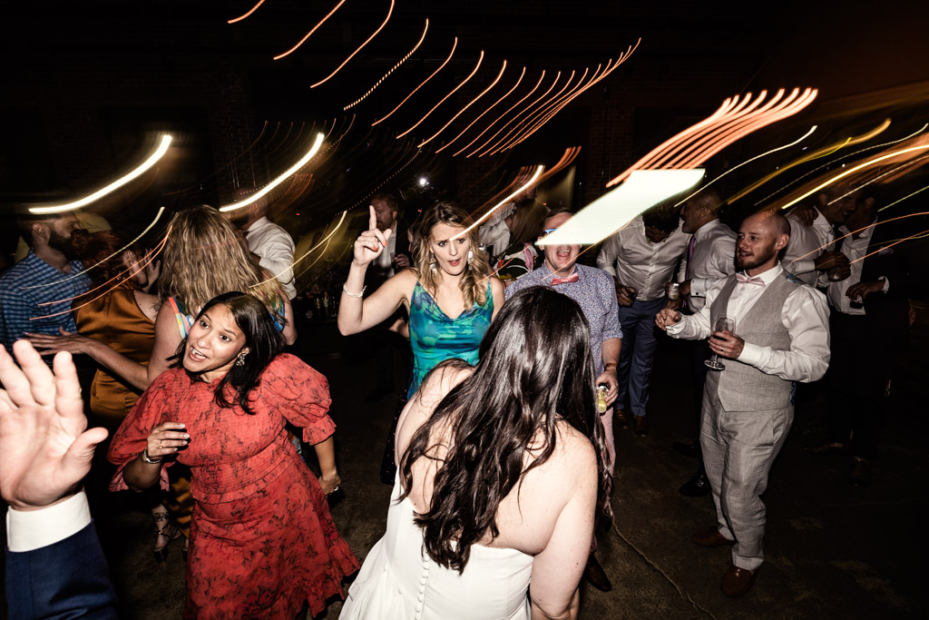 Bride and guests on the dance floor during Ovation Chicago wedding reception