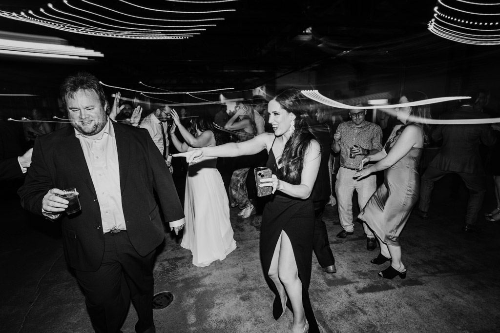 Creative black and white photo of guests dancing during Ovation Chicago wedding reception