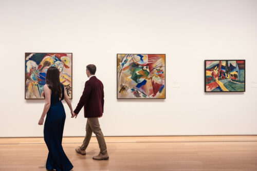 Engaged couple walks through a gallery of the Modern Art Wing of the Art Institute of Chicago