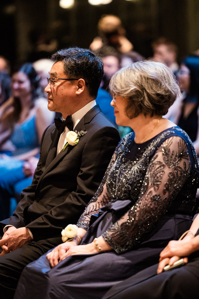 Bride's parents sit side by side during Chicago Winery wedding reception