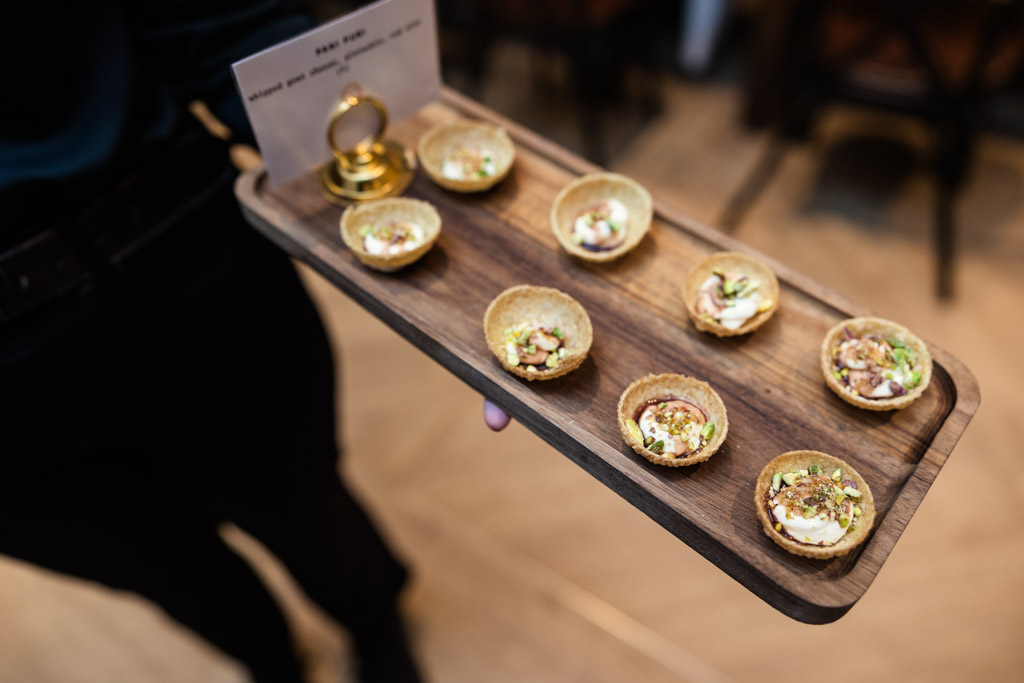 A wooden tray of appetizers for Chicago Winery wedding reception