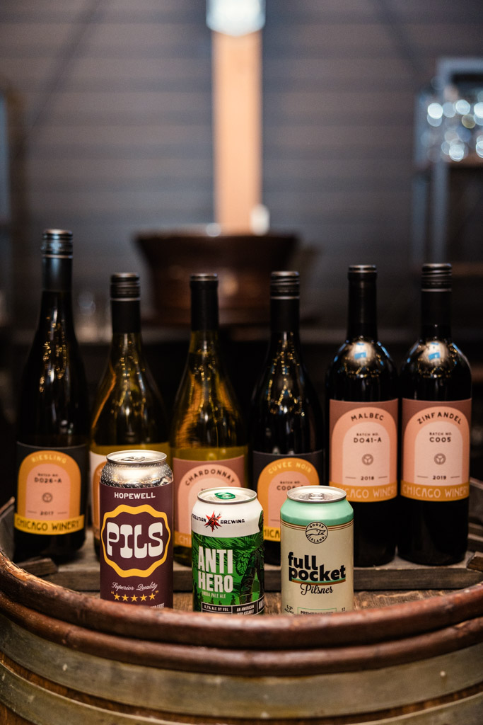 A selection of wines and craft beers served at Chicago Winery wedding reception displayed on a wooden barrel