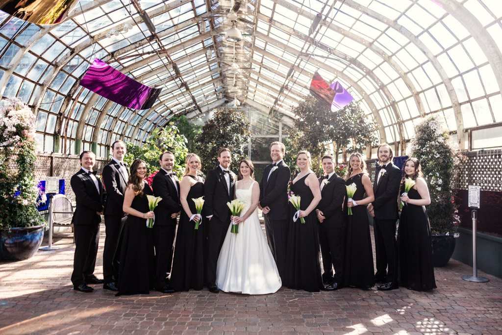 Portrait of wedding party inside Lincoln Park Conservatory in Chicago