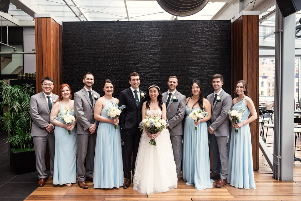 Portrait of bride and groom with their wedding party at The Godfrey Hotel in downtown Chicago