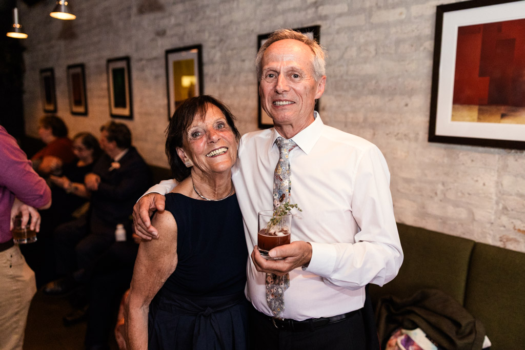 Portrait of guest couple smiling and posing during wedding reception at Ada Street Chicago