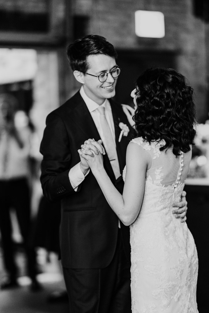 Black and white photo of bride and groom during their first dance at their Ada Street Chicago wedding reception