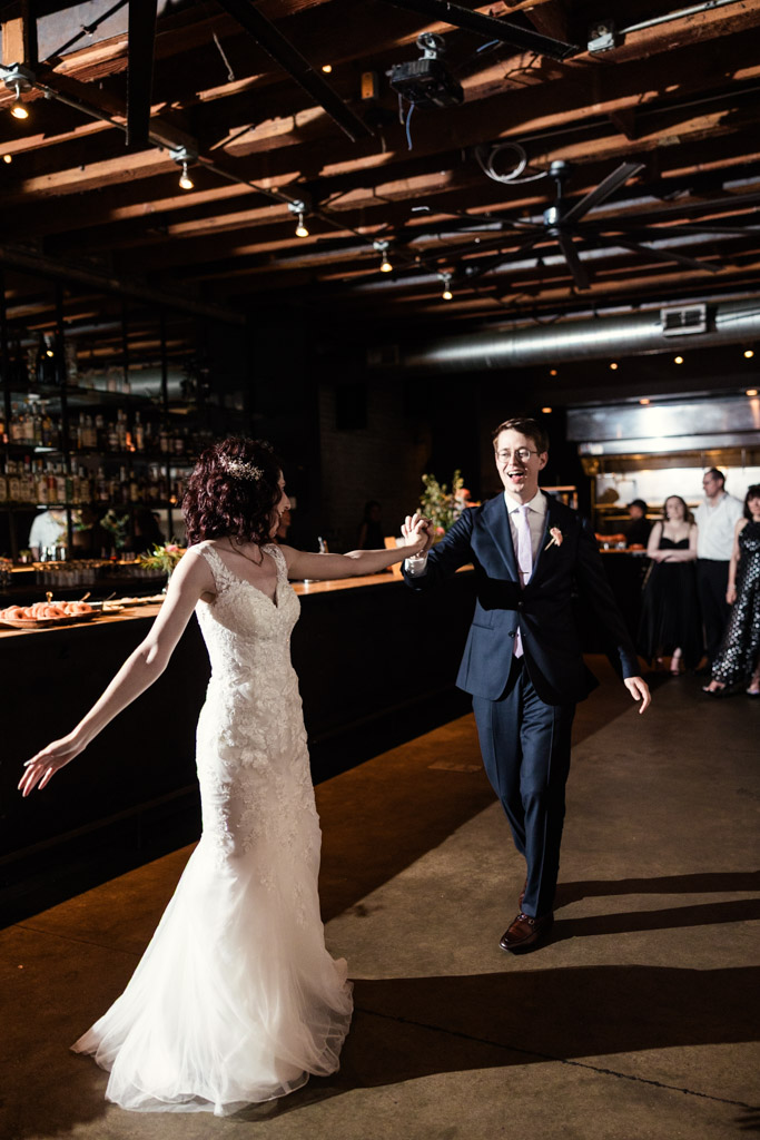 Bride and groom dance together inside Ada Street Chicago