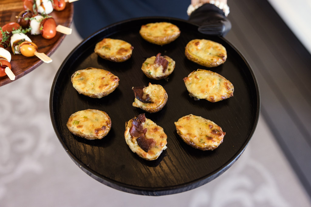A black tray of appetizers for Être Farms wedding reception