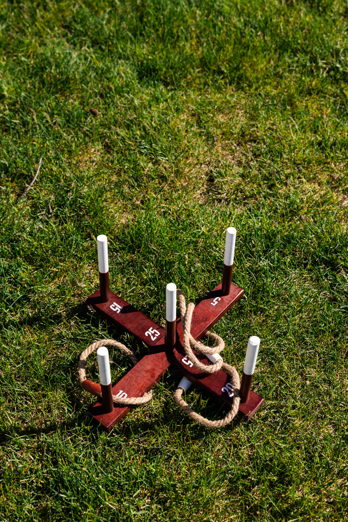 Ring toss game set with numbered wooden pegs and rope rings at Être Farms