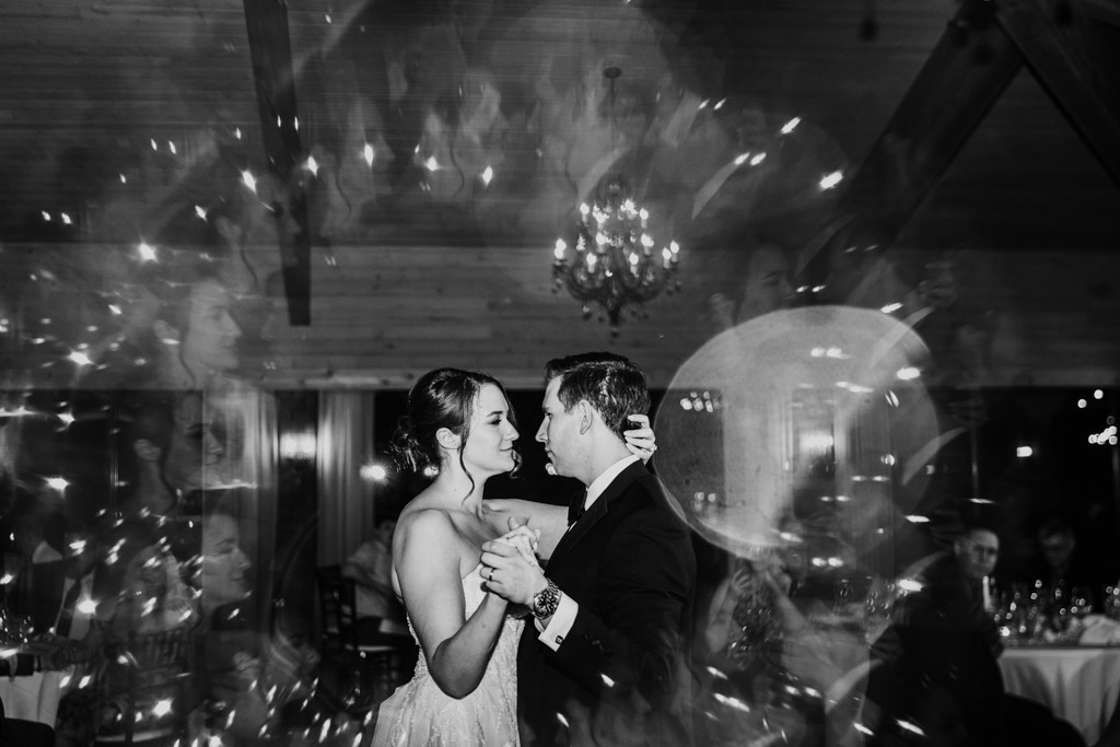 Creative black and white photo of bride and groom during their first dance at Kemper Lakes Golf Club