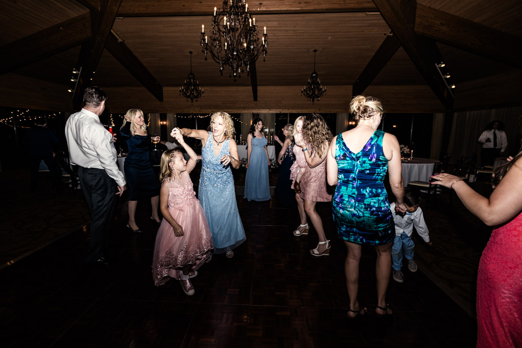 Guests of all ages dance during wedding reception at Kemper Lakes Golf Club