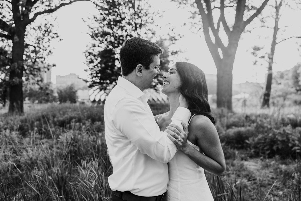 leaning in for a kiss while standing close together near the Honeycomb in Lincoln Park
