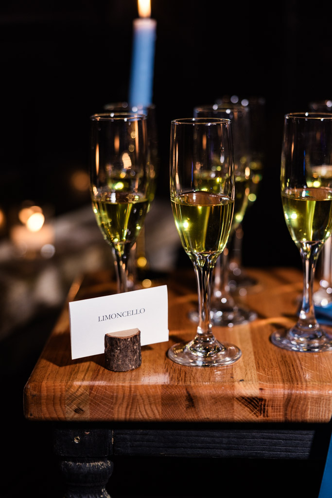 Glasses of limoncello on a wooden table at Osteria Via Stato