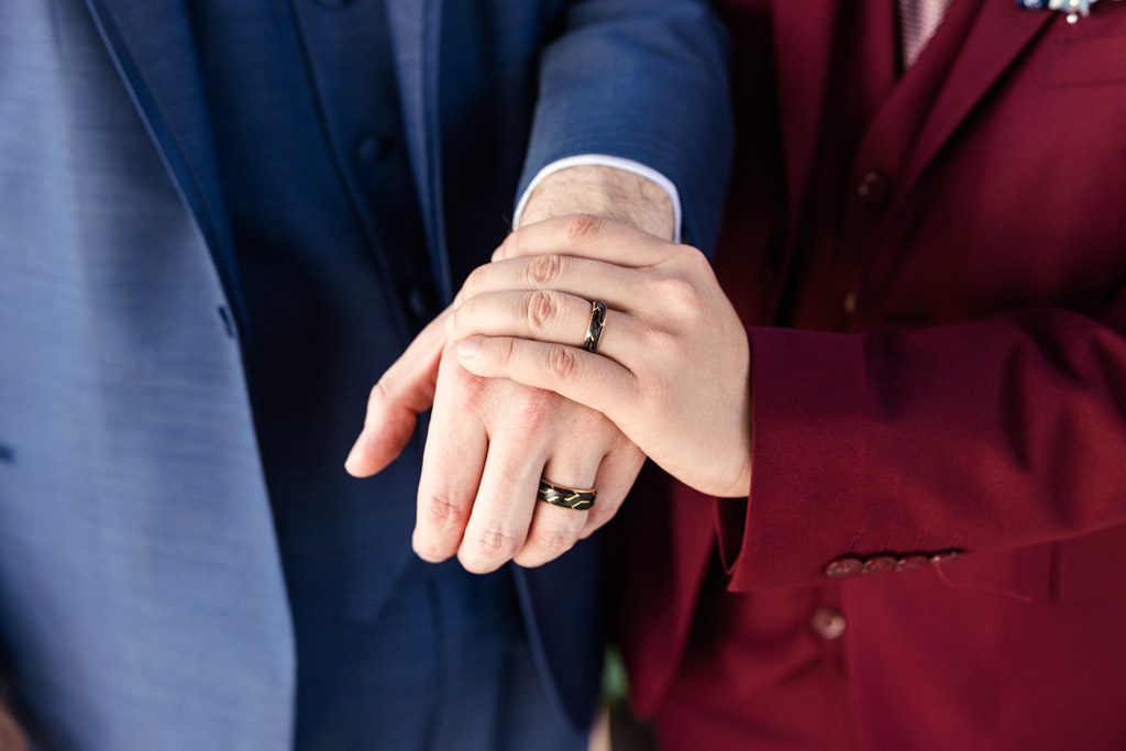 Detail photo of grooms' hands and wedding rings for wedding celebration at The Drake in Oak Brook