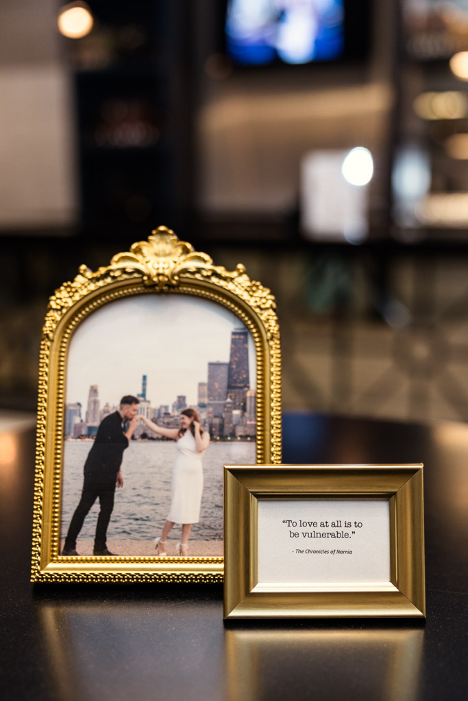 Framed photo of couple and a small gold frame with a quote, for wedding at The Library at 190 in downtown Chicago