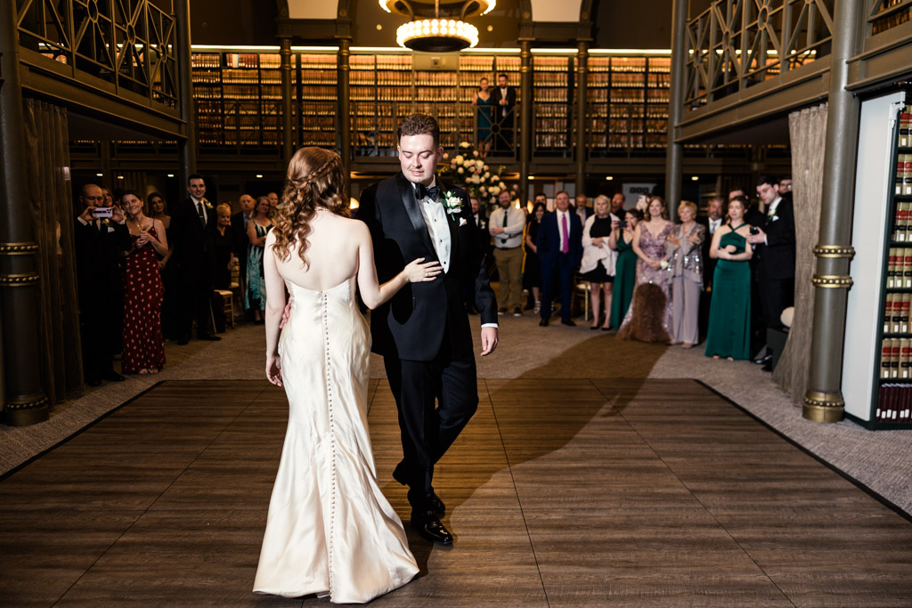 Bride and groom share their first dance surrounded by guests at The Library at 190 in downtown Chicago