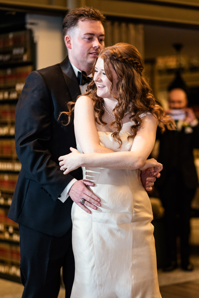 Newlyweds embrace during their first dance at The Library at 190 in downtown Chicago