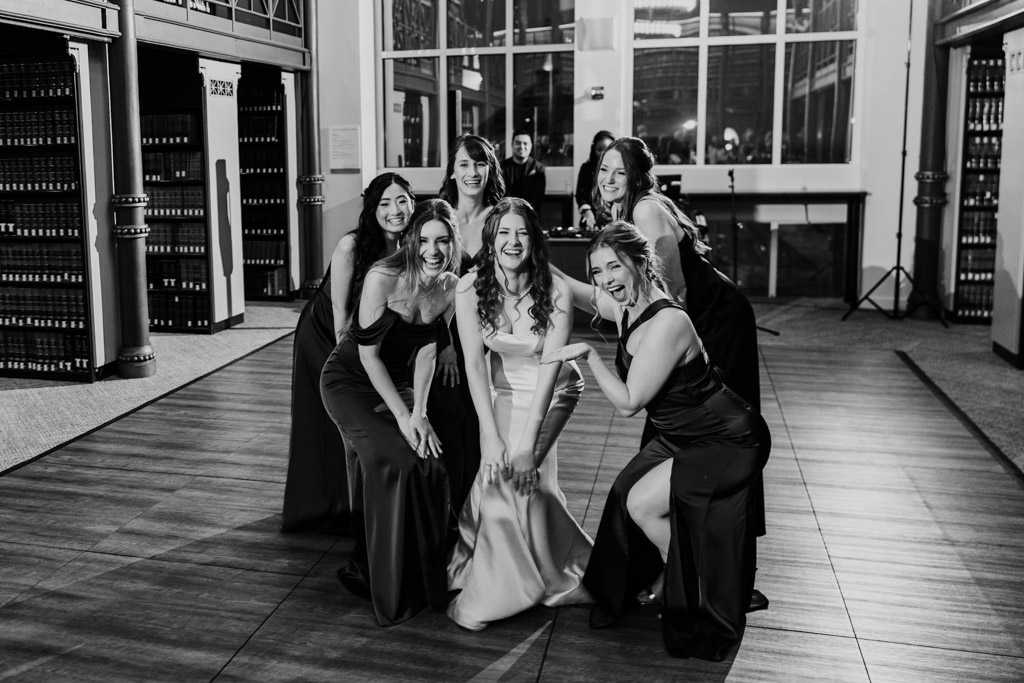 Black and white portrait of bride and bridesmaids on the dance floor during wedding reception at The Library at 190 in downtown Chicago