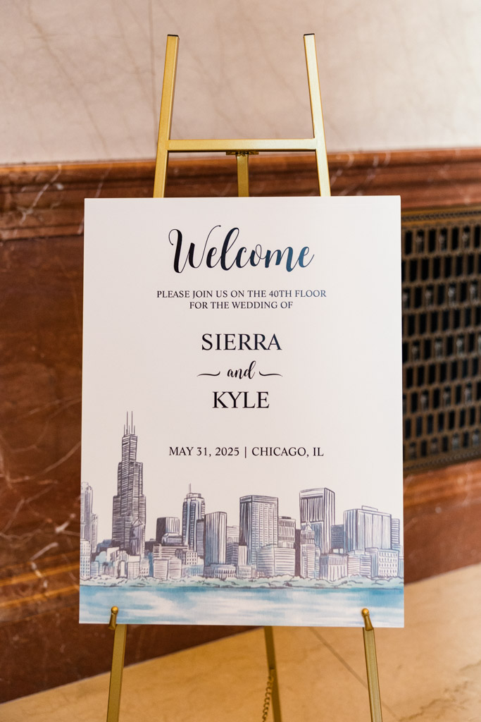 Wedding welcome sign on an easel featuring the Chicago skyline for wedding at The Library at 190 in downtown Chicago