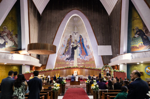 Priest speaks during wedding ceremony at Parroquia San Cayetano in Mexico City.