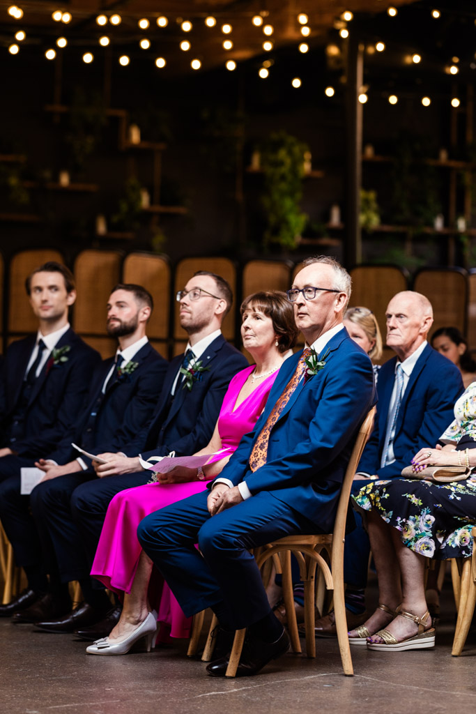 Groom's family seated during wedding ceremony at The Arbory Chicago