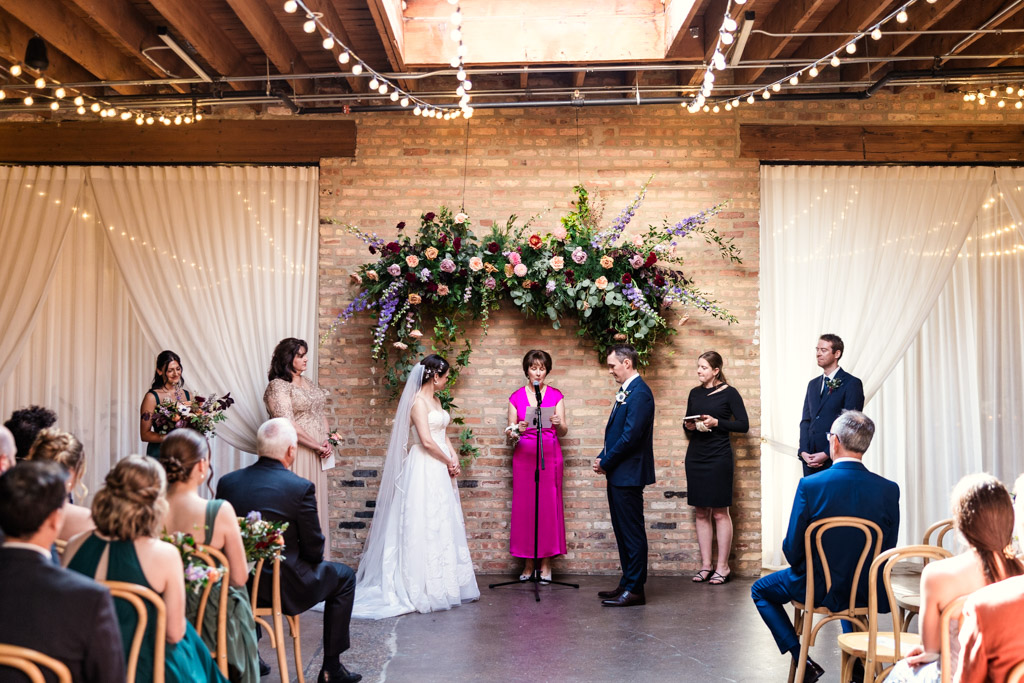 Groom's mother gives a reading during wedding ceremony at The Arbory Chicago