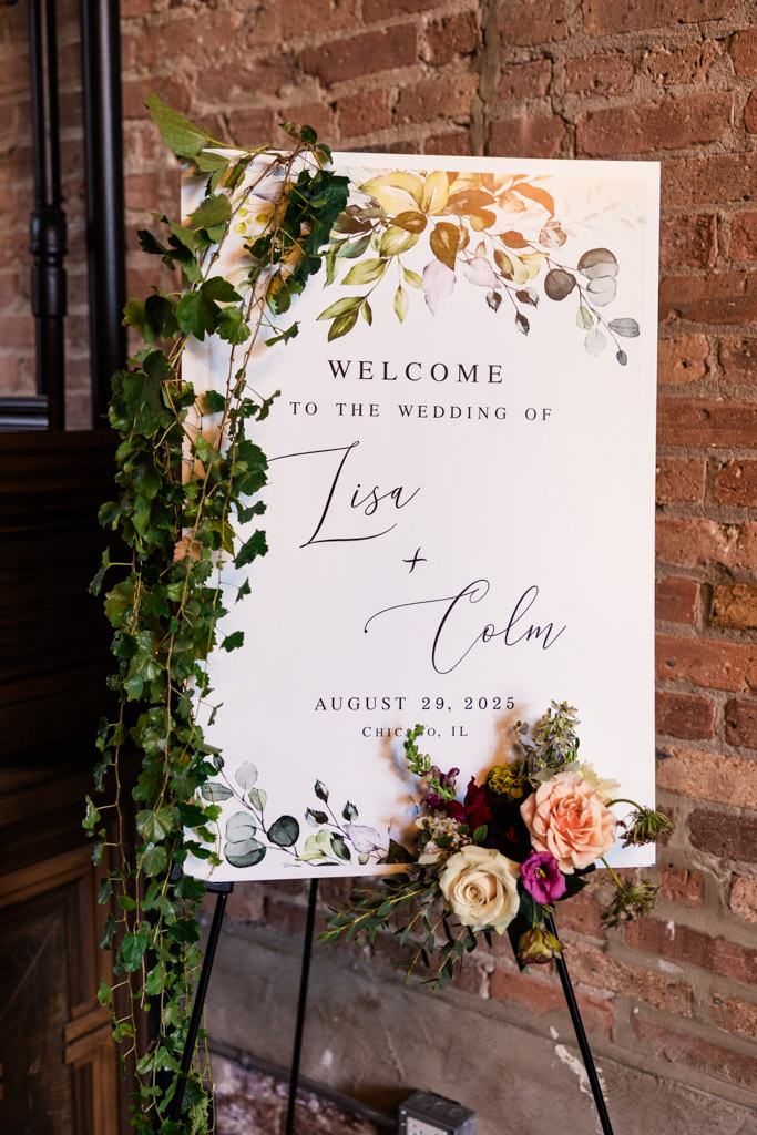 Wedding welcome sign with floral and greenery decorations for wedding celebration at The Arbory Chicago