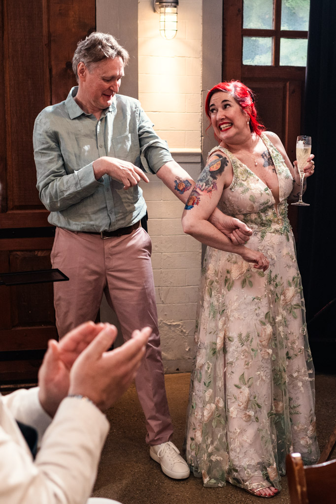 Newlyweds show off their tattoos during their wedding reception at Firehouse Chicago