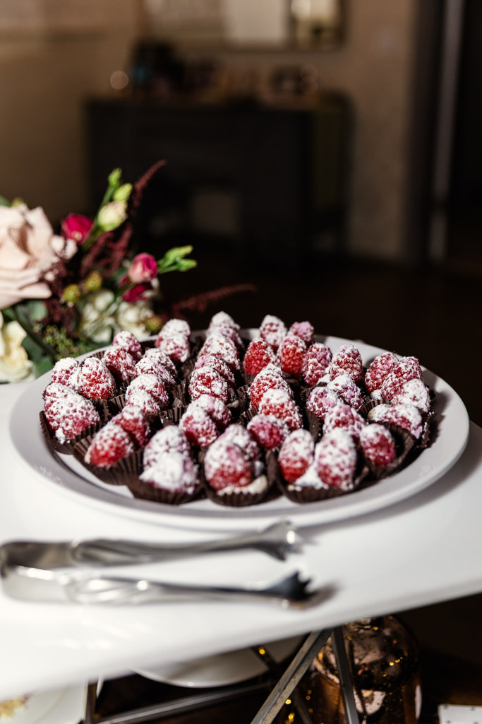 A plate of desserts with serving tongs for wedding reception at Firehouse Chicago