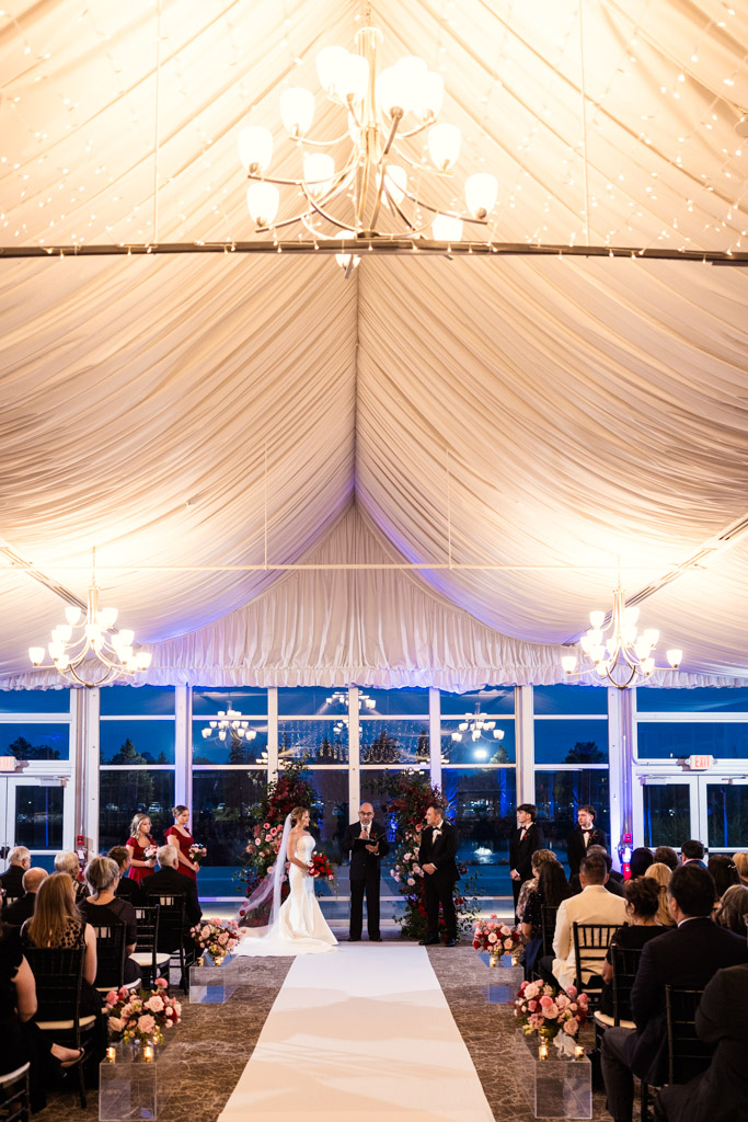 A bride and groom stand at the front of the wedding ceremony space at Lincolnshire Marriott Resort