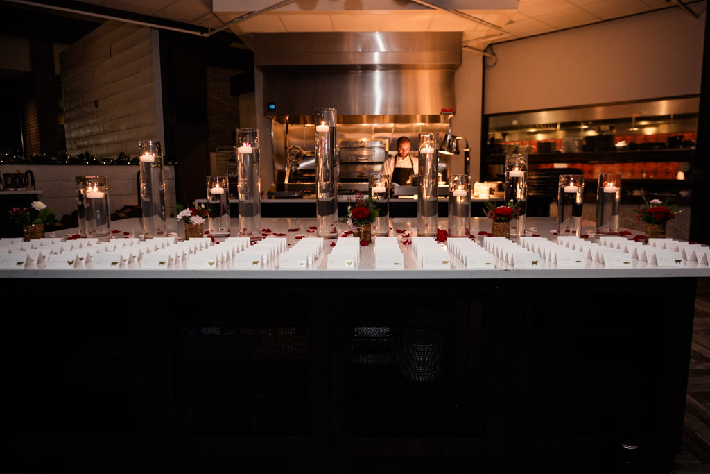 Marble table with place cards, candles, and flowers for wedding reception at Lincolnshire Marriott Resort