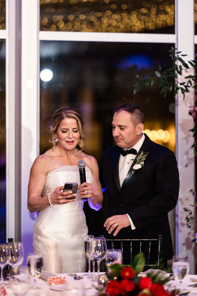 Bride gives speech while the groom stands beside her at their Lincolnshire Marriott Resort wedding reception