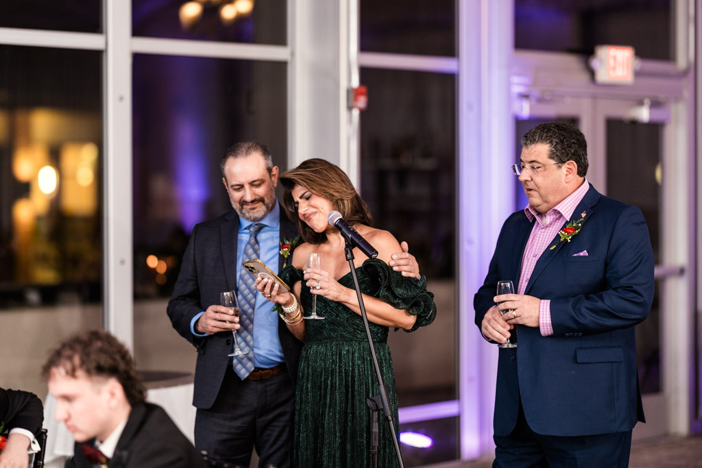 Three guests in formal attire give a speech during wedding reception at Lincolnshire Marriott Resort